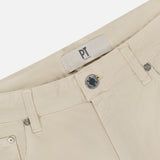 Close-up of the waistband and upper front of the Cotton & Cashmere Stretch Tricotine Jeans in Stone by PT TORINO, featuring a button closure, belt loops, and a PT TORINO label. Expertly crafted in Italy, these jeans combine cotton and cashmere in a refined 5-pocket design for elevated everyday style.