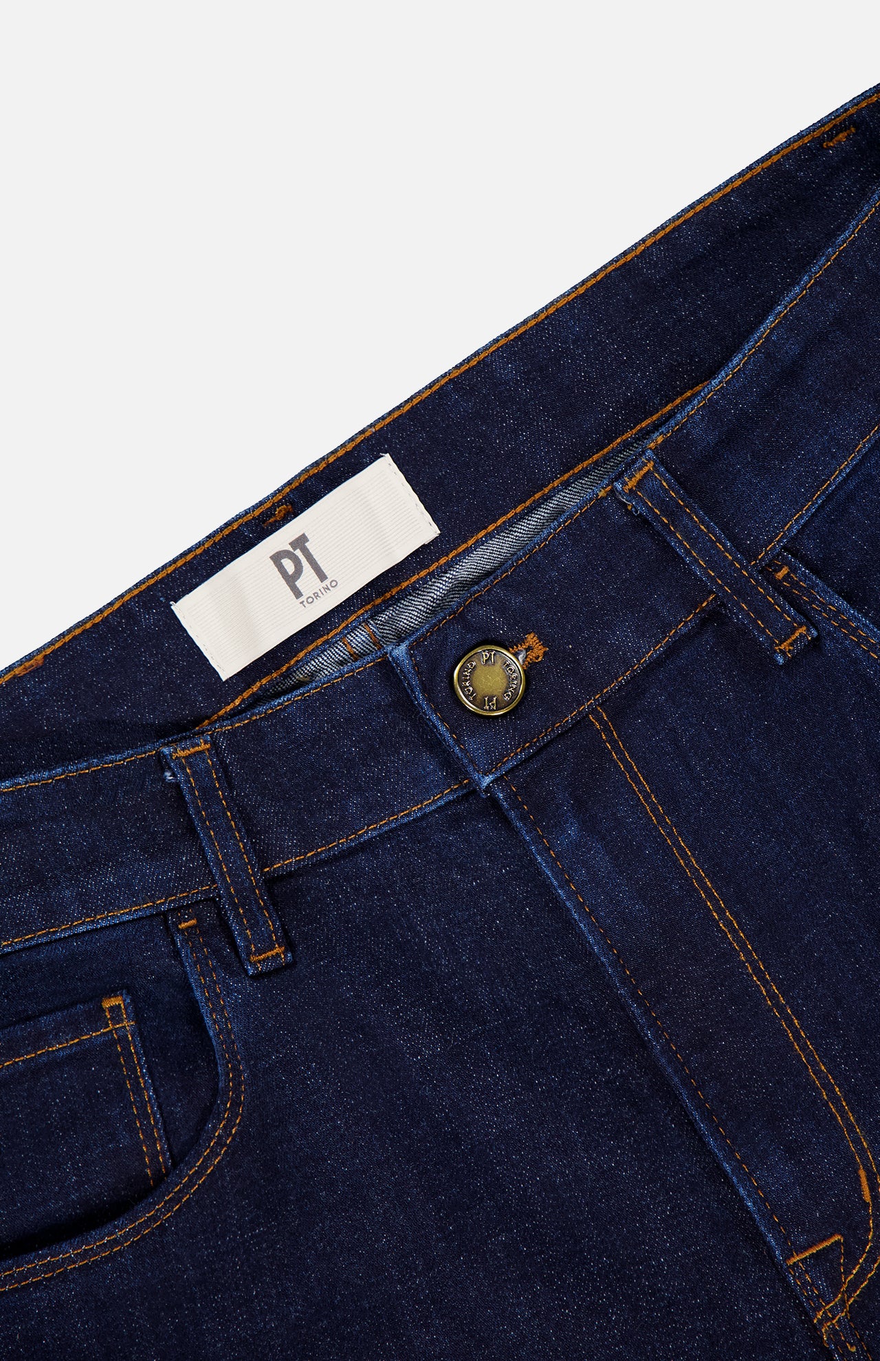 Close-up of PT TORINO Cotton Denim Stretch Jeans in dark blue, featuring orange stitching, a metal button, belt loops, and a white PT TORINO label inside the waistband.