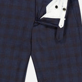 The Demi Foule’ Fancy Wool Trouser Pants by PT TORINO feature a navy blue plaid design, tailored slim fit, partially open front with white lining, button details, and zipper fly—ideal for modern professional style.