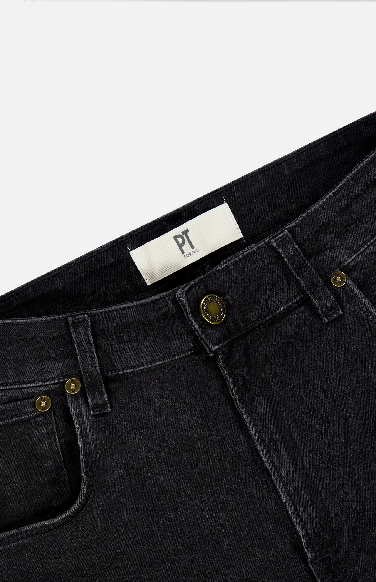 Close-up of the waistband and front pockets of PT TORINO Jazz Denim Stretch Jeans in black denim, featuring brass rivets, a button closure, belt loops, and a white inner label reading PT TORINO. The classic details give these stretch jeans a timeless yet comfortable appeal.