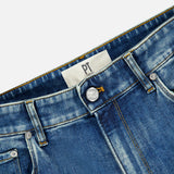Close-up view of the New Denim 5-Pocket Jeans by PT TORINO, highlighting the waistband, button, belt loops, front pockets, and a white PT TORINO label on the inside.