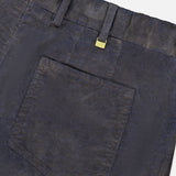 Close-up of the back pocket and waistband of navy Slim Stretch Cotton Corduroy Trouser Pants by PT Torino, featuring a small metallic PT label attached to a belt loop.