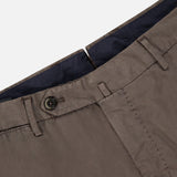 Close-up of the waistband and front of PT TORINO’s Slim Flat Front Soft Fine Trouser Pant in brown, featuring a button closure, belt loops, and visible stitching—ideal for the professional man seeking a slim fit.