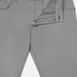 A pair of Soft Stretch Gabardine Pants in Grigio by PT TORINO with the front zipper and button undone, revealing the waistband, pocket, inside fabric, and an inner waistband label marked “PT.”.
