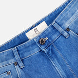 Close-up of the waist on PT TORINO's Soft Touch Light Stretch Jeans in blue denim, featuring a black button, belt loops, front pockets, and an inner white label with "PT" on the waistband.