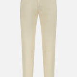 The PT TORINO Stretch Clean Silkochino Pants are slim-fit, off-white cotton silk pants featuring a 5-pocket design, belt loops, and button closure, shown on a white background.
