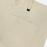 Close-up of PT TORINO Stretch Clean Silkochino Pants in off-white, featuring a large square back pocket, belt loops, visible stitching on smooth fabric, and a classic 5-pocket design.