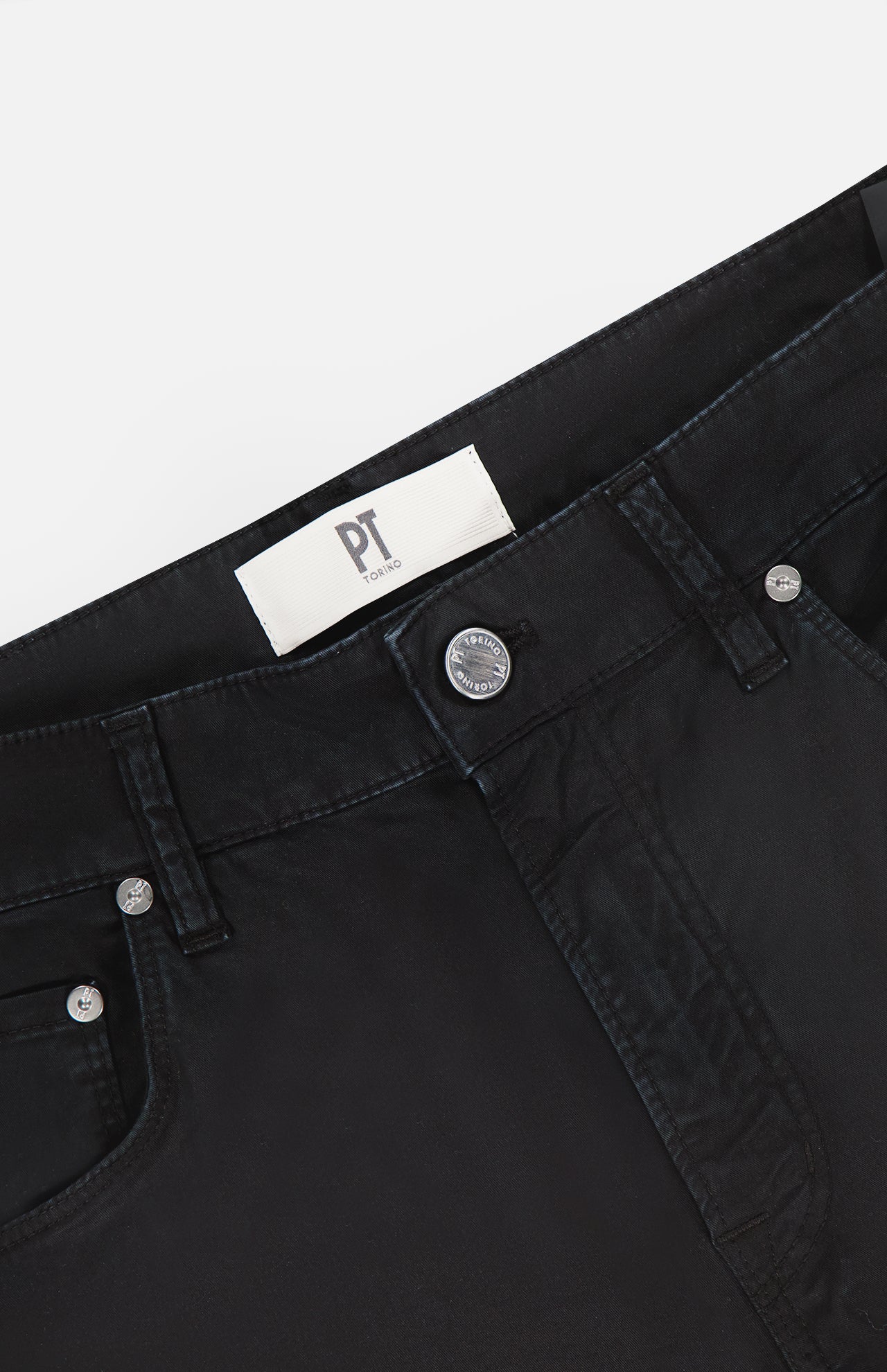 Close-up of the waistband and upper section of PT TORINO Stretch Gabardine 5-Pocket Pants in black, featuring silver buttons, belt loops, a white PT TORINO label inside, and Italian craftsmanship.