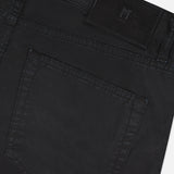 Close-up of the back pocket of PT TORINO Stretch Gabardine 5-Pocket Pants in black, featuring visible stitching, a black leather brand patch near the waistband, and classic 5-pocket detailing.