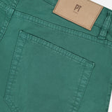 Close-up of the back pocket and waistband of PT TORINO Stretch Gabardine 5-Pocket Pants in green, with a brown leather logo patch above the pocket, visible stitching, and a classic 5-pocket design.