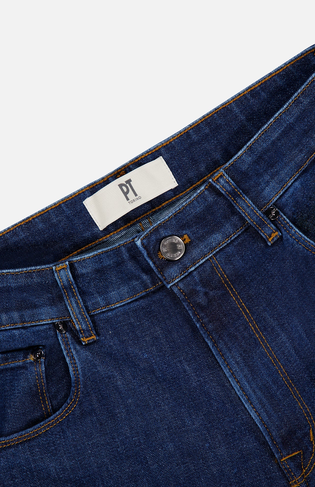 Close-up of the waistband and upper section of Stretch Japan Denim Jeans by PT TORINO in dark blue with contrast stitching, silver button, belt loops, and a white PT label.