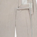 The PT TORINO Summer Stretch Pinstripe Seersucker Slim Jogger features beige and white stripes, a drawstring waistband, button and zipper fly, and is partially unzipped to reveal the interior lining—ideal for warm weather.