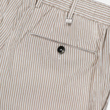 Close-up of PT TORINO’s Summer Stretch Pinstripe Seersucker Slim Jogger, showcasing beige and white stripes, belt loops, waistband, and a buttoned back pocket—ideal lightweight trousers for warm weather.