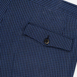 Close-up of a blue textured fabric pocket on PT TORINO Super 100's Wool Fancy Trouser Pants, featuring a checkered pattern, horizontal flap with dark button closure, and subtle detailing.