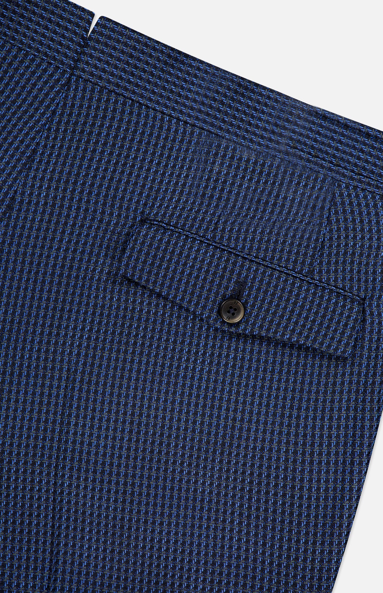 Close-up of a blue textured fabric pocket on PT TORINO Super 100's Wool Fancy Trouser Pants, featuring a checkered pattern, horizontal flap with dark button closure, and subtle detailing.
