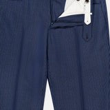 PT TORINO Super 100's Wool Fancy Trouser Pants in navy, featuring a subtle vertical pattern and shown partially unbuttoned to reveal a crisp white inner waistband and lining.