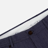 Close-up of the waistband and upper front section of the PT TORINO Thermo Superlight Stretch Wool Trouser Pants in navy, showcasing a visible button, partial inner lining, and textured stretch wool fabric. The design includes belt loops and side pockets, highlighting the high-quality craftsmanship.