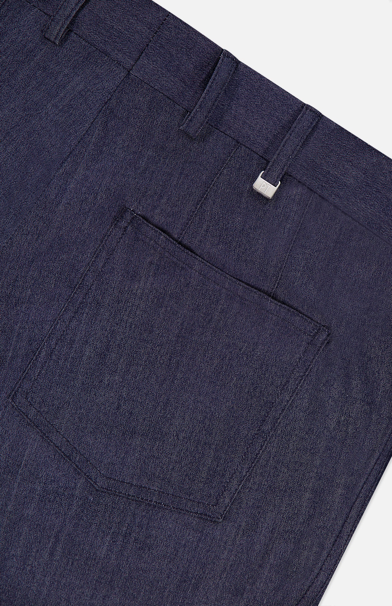 Close-up of the back pocket and waistband of PT TORINO Thermo Superlight Stretch Wool Trouser Pants, showcasing refined belt loops and a discreet fabric tag near the top right—details that echo the craftsmanship typically found in luxury garments.