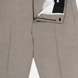 A pair of PT TORINO Traveler Light Stretch Structure Trouser Pants in beige, shown with the front fly unzipped and waistband partially open to display the white inner lining and black button closure. Ideal for workdays or weekends, these travel pants offer a stylish yet comfortable option for those constantly on the move.
