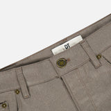 Close-up of the waistband of grey Wool & Cashmere Flannel Pants by PT Torino, featuring a button closure and metal rivets.