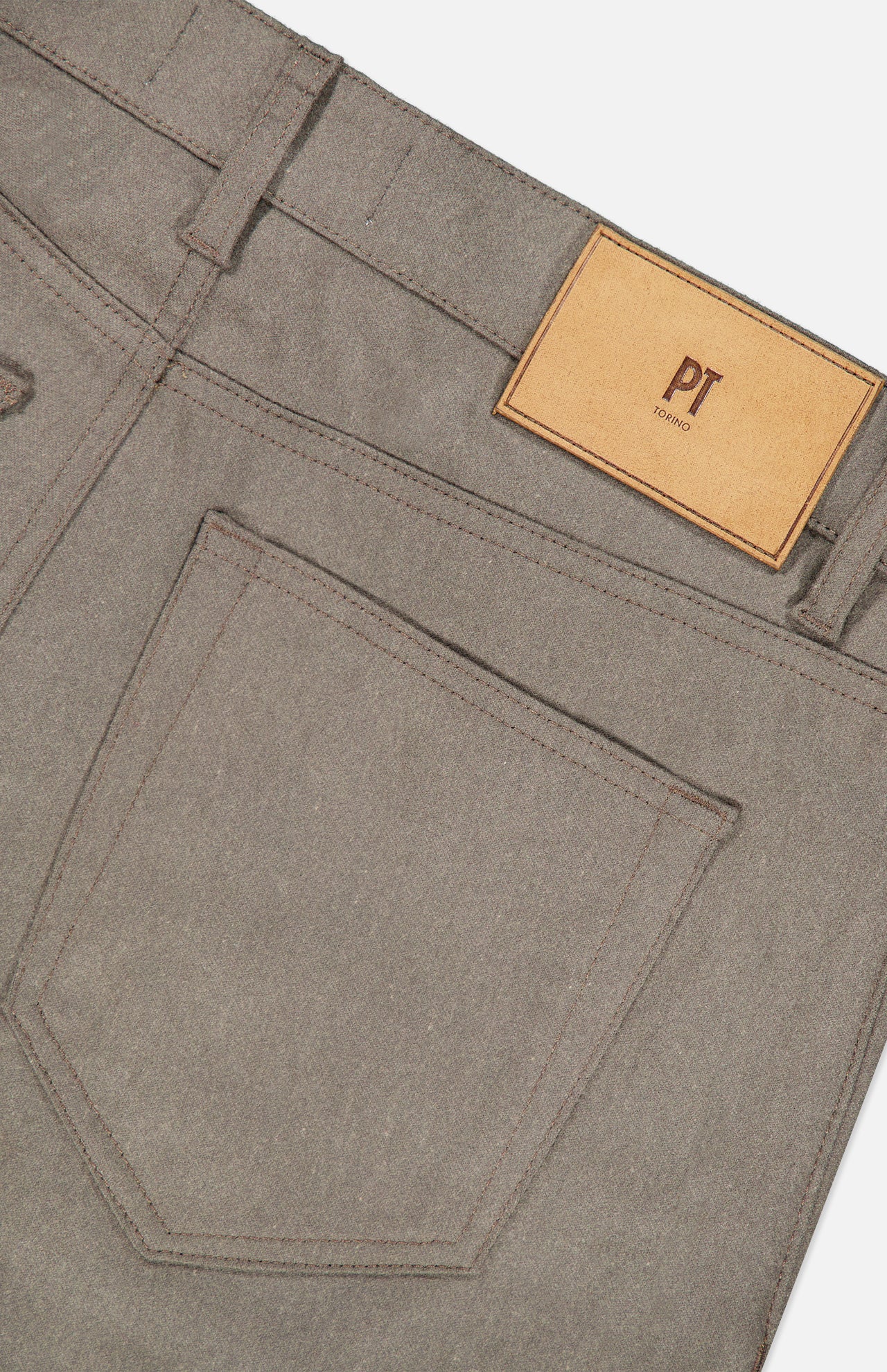 Close-up of the back of grey Wool & Cashmere Flannel Pants by PT Torino, showing a back pocket, belt loops, and a tan leather brand label.