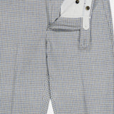 PT TORINO Wool Cashmere Flannel Trouser Pants in light blue check, shown partially unzipped to reveal the white inner waistband and button closures. Slim fit, subtle pattern, tailored for a formal look.