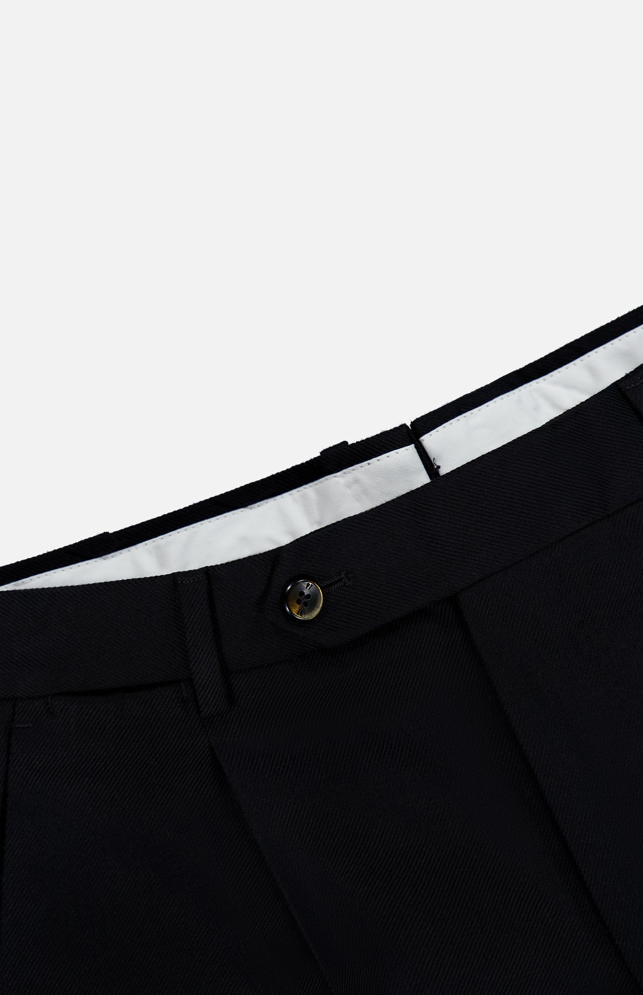 Close-up of the waistband of the PT TORINO Wool Cotton Soft Bull Trouser Pant in black, featuring a visible button, belt loops, and white inner lining against a plain background—perfect for professional dressing.