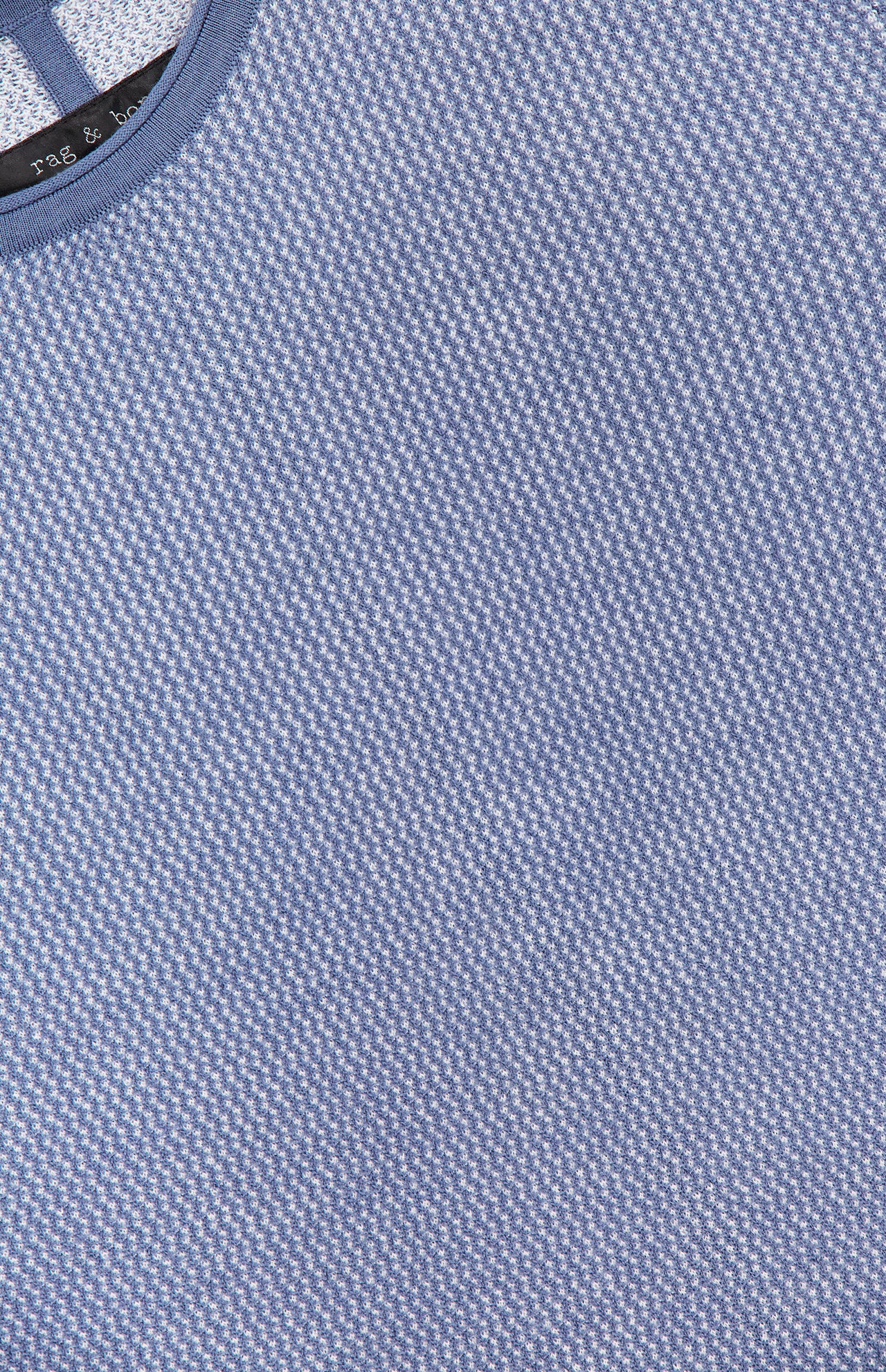 Close-up of the RAG & BONE Gregory Merino Long Sleeve Crewneck Sweater in light blue, featuring a round neckline with blue trim and a subtle textured pattern.