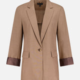 The RAG & BONE Jennifer Combo Blazer is a beige single-button style with notched lapels, flap pockets, and three-quarter sleeves with brown pinstriped cuffs. Pair it with the matching vest for a coordinated look.