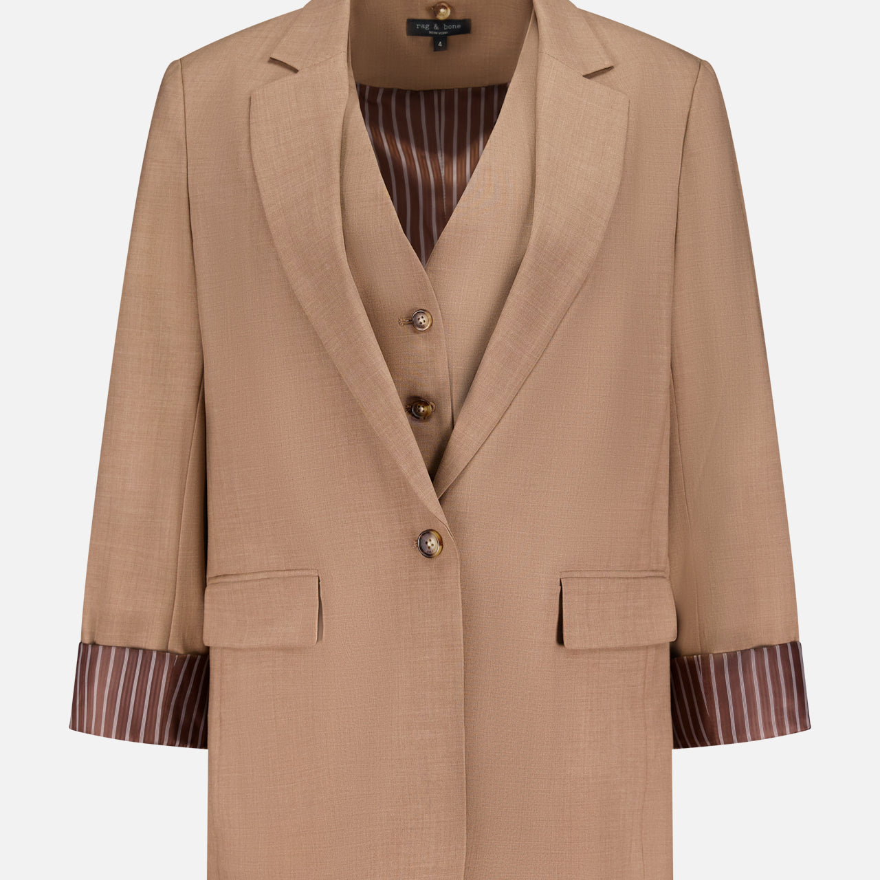 The Jennifer Combo Blazer by RAG & BONE features tan wool-blend fabric, notched lapels, flap pockets, and brown striped lining at the rolled cuffs. A matching vest with brown buttons is layered underneath, all set against a plain white background.