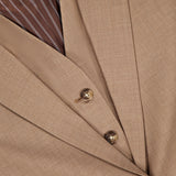 Close-up of the RAG & BONE Jennifer Combo Blazer in tan wool blend, featuring three brown buttons, overlapping lapels, and a brown-and-white striped inner lining.