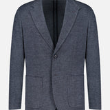 The Becker Knit Sportcoat by RAG & BONE is a dark grey jacket crafted from a lightweight cotton-blend with a textured finish, featuring two front patch pockets, a notched lapel, and a single button closure—an elevated interpretation of the classic British sport coat, shown against a plain white background.