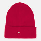 The Brooks Stretch Beanie by RAG & BONE is a bright red ribbed knit beanie featuring a folded cuff and a small oval patch on the front, shown against a plain white background.