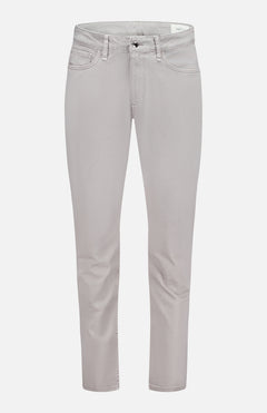 The RAG & BONE Fit 3 Aero Stretch Pant is shown in light gray against a white background. Made from comfort denim with Aero Stretch technology, these slim-fit pants provide outstanding flexibility and movement. They feature front and back pockets, belt loops, and a button-and-zipper closure. The straight legs are slightly cropped at the ankles for a modern finish.