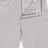 The Fit 3 Aero Stretch Pant in light grey, featuring a partially open zipper and button fly, displays the waistband label with the RAG & BONE brand and size 32. Crafted from comfortable denim with Aero Stretch technology, these pants are laid flat against a plain background.