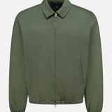 The Harrington Cotton Jacket by RAG & BONE, crafted from khaki green cotton twill, features a classic collar, elastic cuffs, and side pockets. Inspired by timeless British sportswear style, it is displayed on a plain white background.
