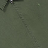 Close-up of the olive green Harrington Cotton Jacket by RAG & BONE, featuring a classic collared design with a zipper and a subtle embroidered logo on the chest, inspired by traditional British sportswear. The RAG & BONE tag is partially visible near the collar.