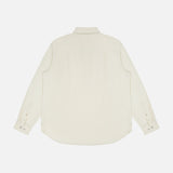 The Popover Long Sleeve Shirt by RAG & BONE is shown from the back in cream cotton, featuring a classic collar, buttoned cuffs, and a curved hem—ideal for those wanting a timeless minimalist look.
