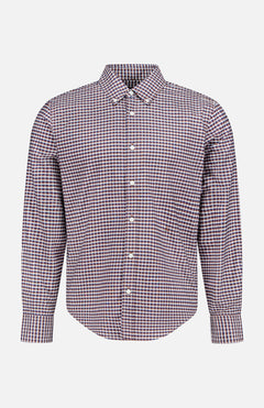 The Classic Oxford Dress Shirt by RAG & BONE features long sleeves, a button-up front, and a collared neckline. Showcasing a subtle small checkered pattern in shades of red, white, and blue, this shirt is crafted from 100% cotton and is presented against a plain white background.