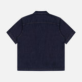 Back view of the RAG & BONE Resort Denim Shirt, a short-sleeve, featherweight camp shirt with contrast stitching and a straight hem, shown on a plain white background.