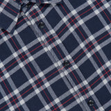 Close-up of a navy blue, white, and red plaid Tomlin Flannel Shirt by RAG & BONE, featuring a visible collar, black buttons, and neck tag.