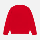 The Vernon Cashmere Crewneck Sweater by RAG & BONE is shown laid flat, back view, in bright red. It features long sleeves and ribbed cuffs and hem against a white background.