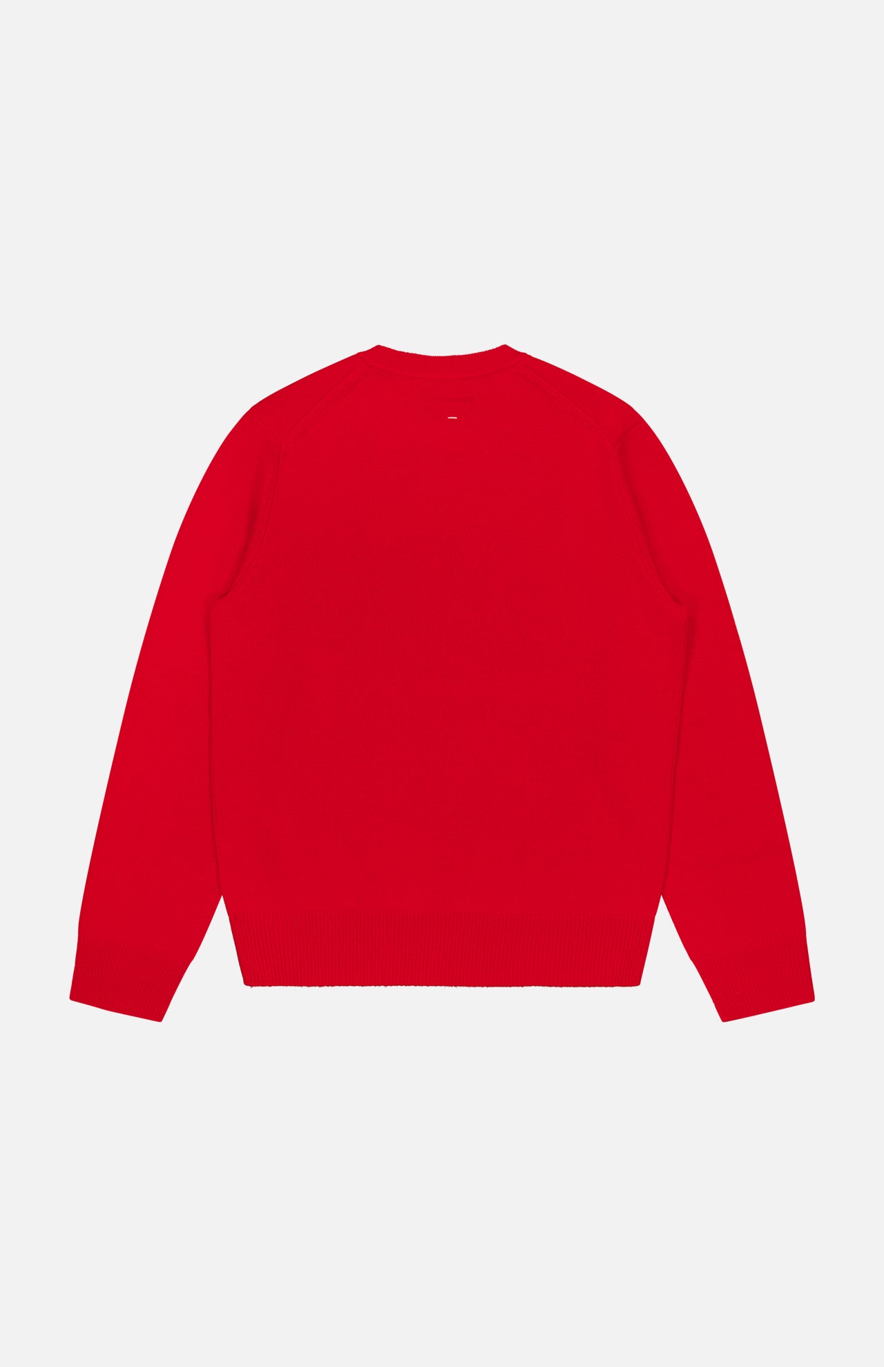 The Vernon Cashmere Crewneck Sweater by RAG & BONE is shown laid flat, back view, in bright red. It features long sleeves and ribbed cuffs and hem against a white background.