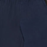 Close-up of the Olivia Contrast Stripe Pant by RAG & BONE, featuring a relaxed fit, navy hue, elastic waistband, subtle stitching, and a smooth, slightly shiny silk texture.