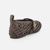 The RAG & BONE Spire Mary Jane Faux Leather Flats feature dark brown woven material, closed toes, gold side buckles, and faux leather accents, shown from a rear side angle on a white background.