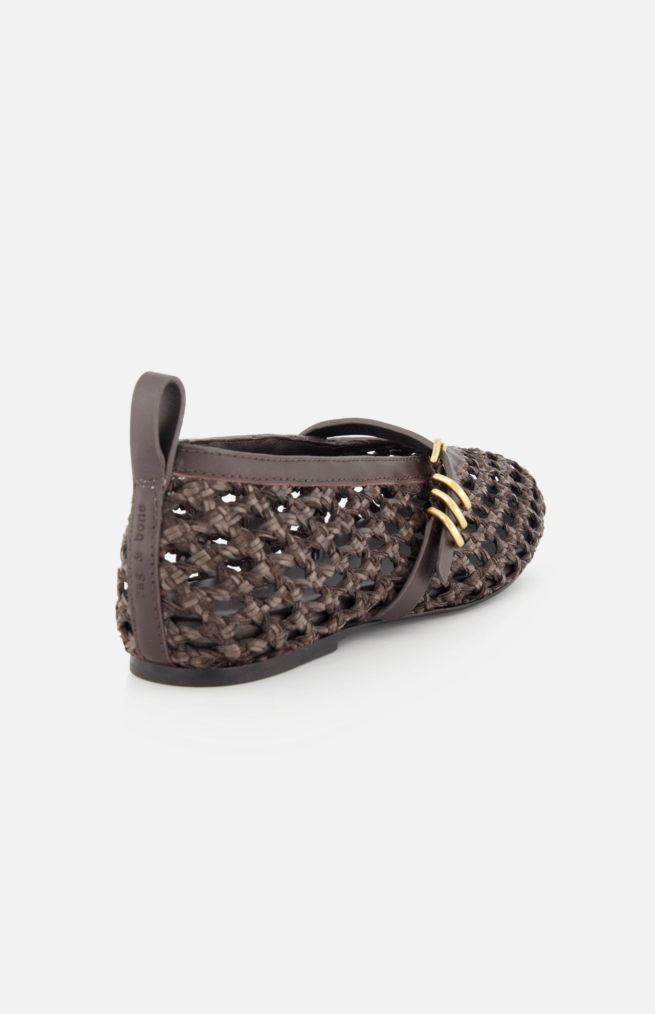 The RAG & BONE Spire Mary Jane Faux Leather Flats feature dark brown woven material, closed toes, gold side buckles, and faux leather accents, shown from a rear side angle on a white background.