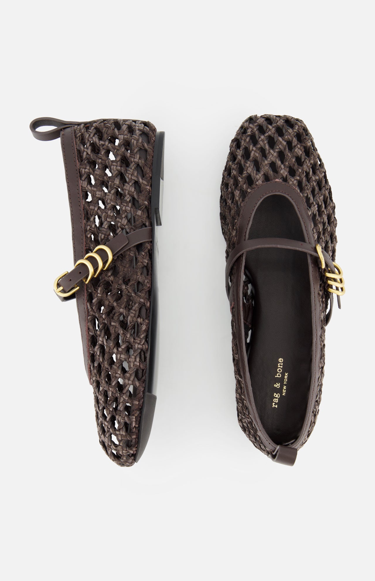 The Spire Mary Jane Faux Leather Flats by RAG & BONE are dark brown woven shoes with gold buckles, a basket-like texture, closed heel, and back loop. Shown on a white background with one flat top view and one side view.