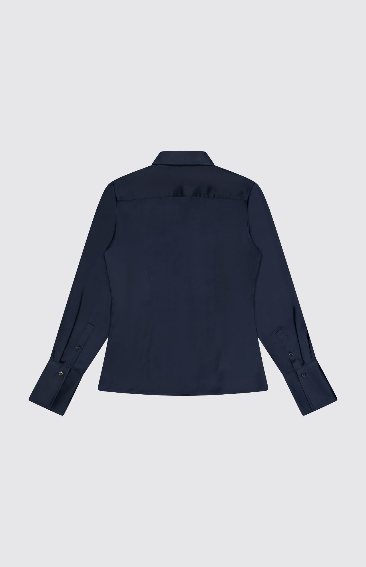 The Venus Popover Removable Cami Blouse by RAG & BONE is shown from the back in dark navy satin, featuring long sleeves, a classic collar, buttoned cuffs, and a removable camisole lining against a plain light gray background.