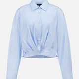 The Andy Pleated Drawcord Top by RAG & BONE is a light blue, long sleeve cotton blouse with a collar, button-down front, pleated details, and a gathered hem, shown on a plain white background.