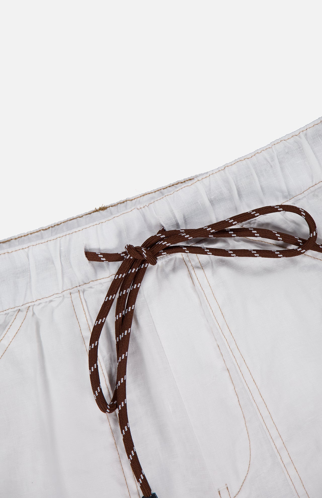 Close-up of the Atlas Drawcord Linen Pant by RAG & BONE featuring a high-rise drawstring waist tied in a bow, white linen fabric, and light brown stitching, set against a plain white background.